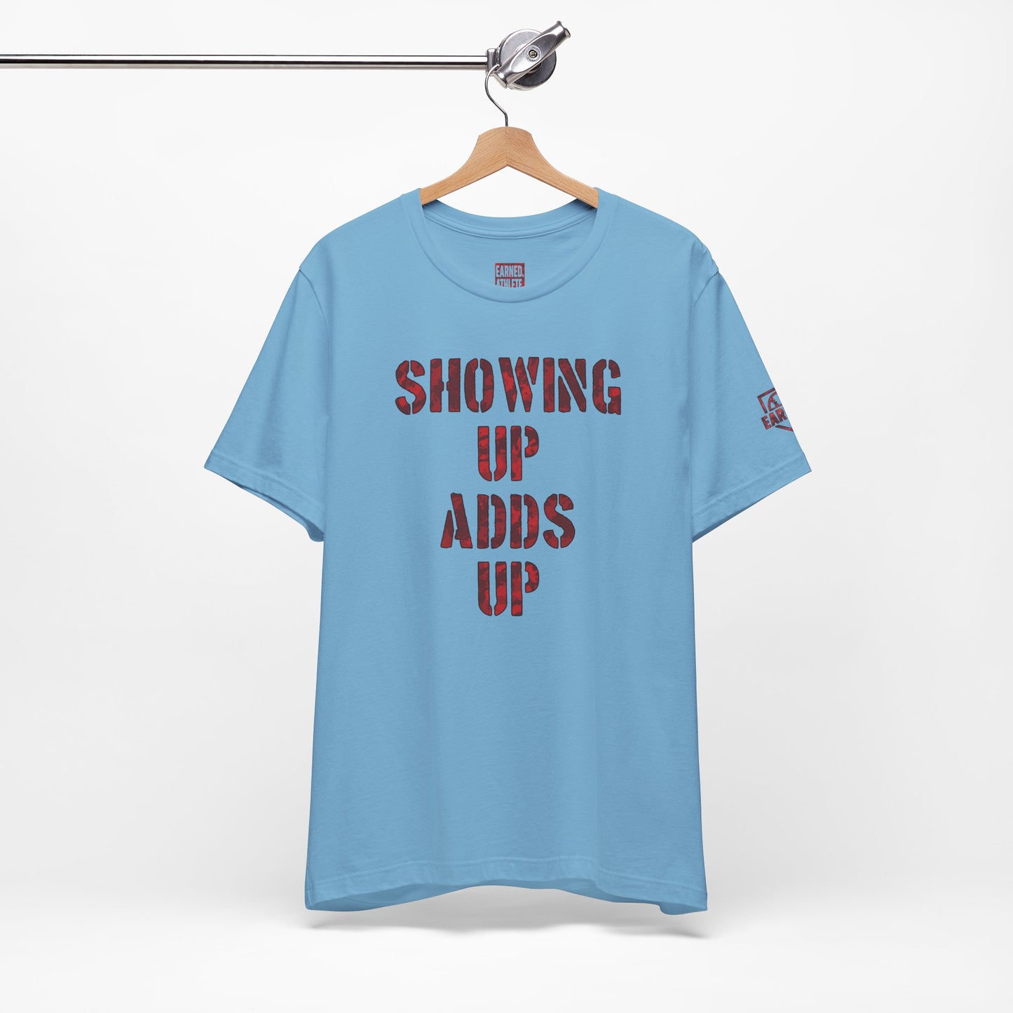 SHOWING UP ADDS UP Tee (Red Camo Font)