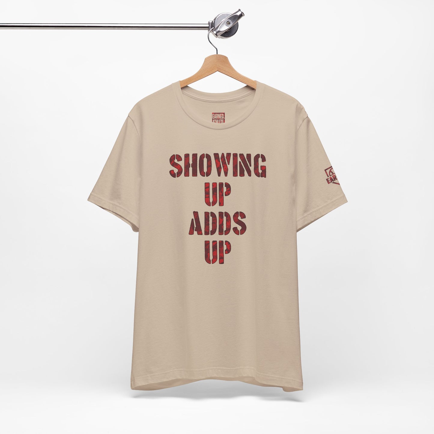 SHOWING UP ADDS UP Tee (Red Camo Font)